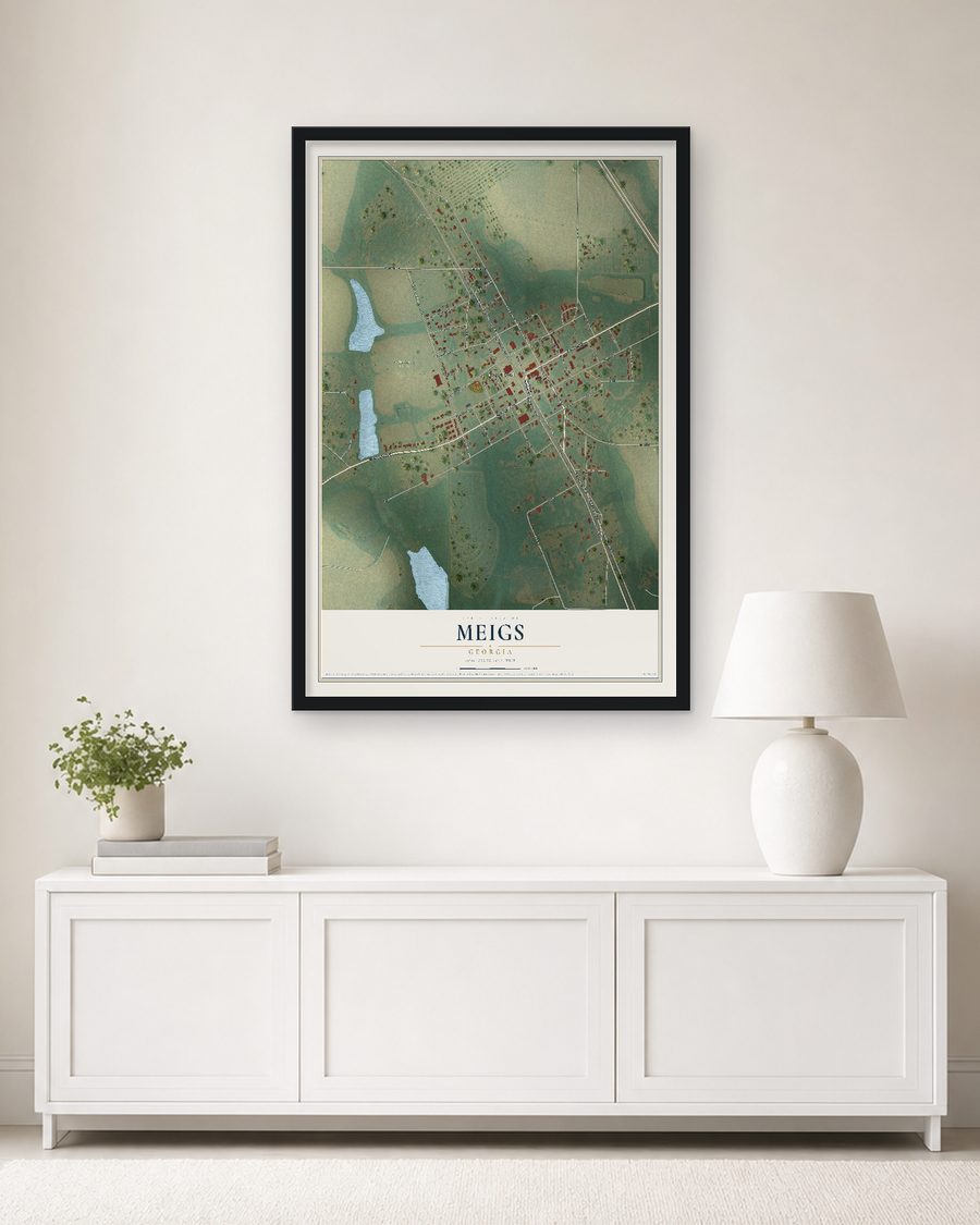 The Meigs, Georgia map, 24 x 36 in, in a black wood frame on a living room wall