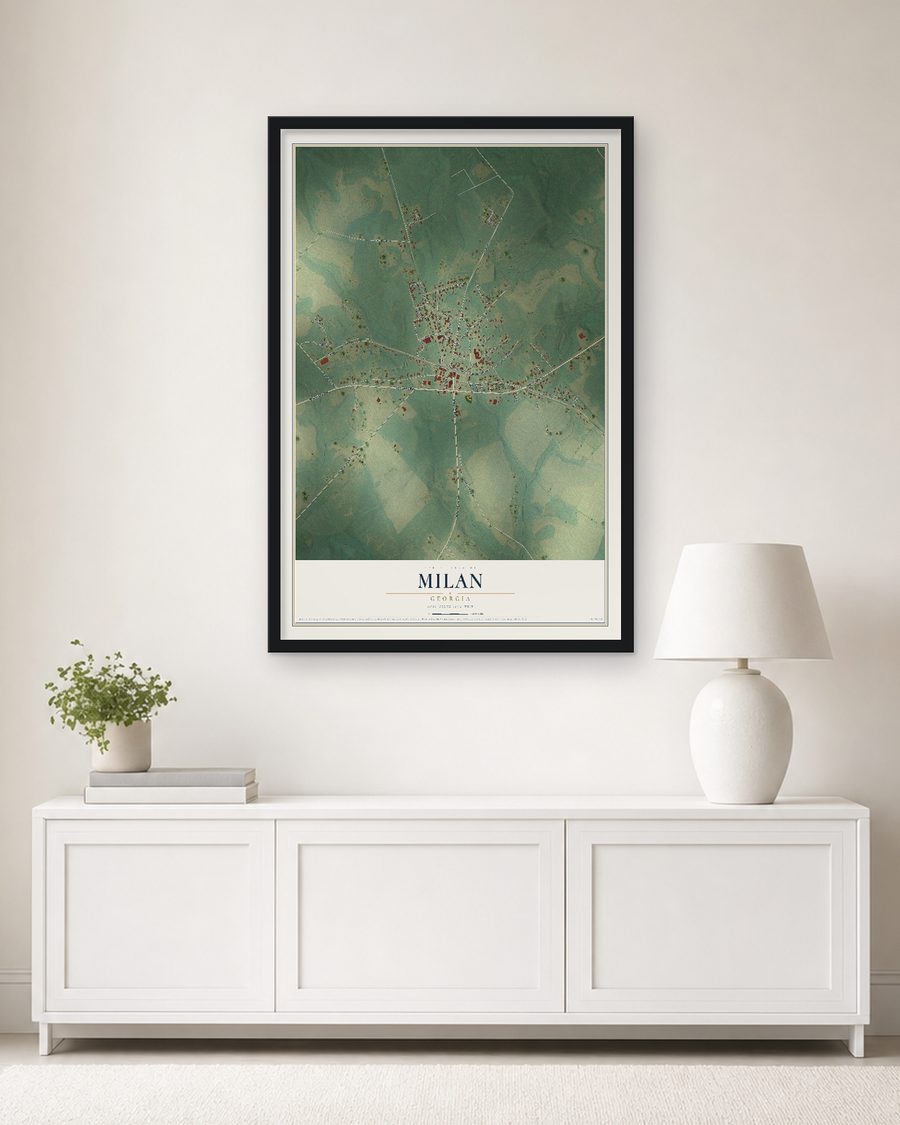 The Milan, Georgia map, 24 x 36 in, in a black wood frame on a living room wall