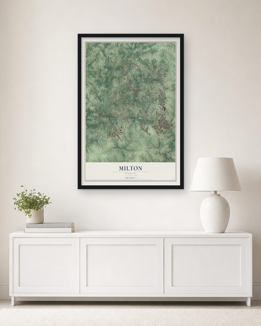 The Milton, Georgia map, 24 x 36 in, in a black wood frame on a living room wall