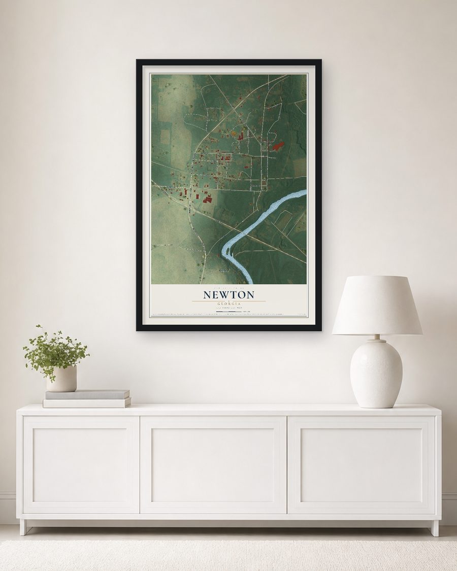 The Newton, Georgia map, 24 x 36 in, in a black wood frame on a living room wall