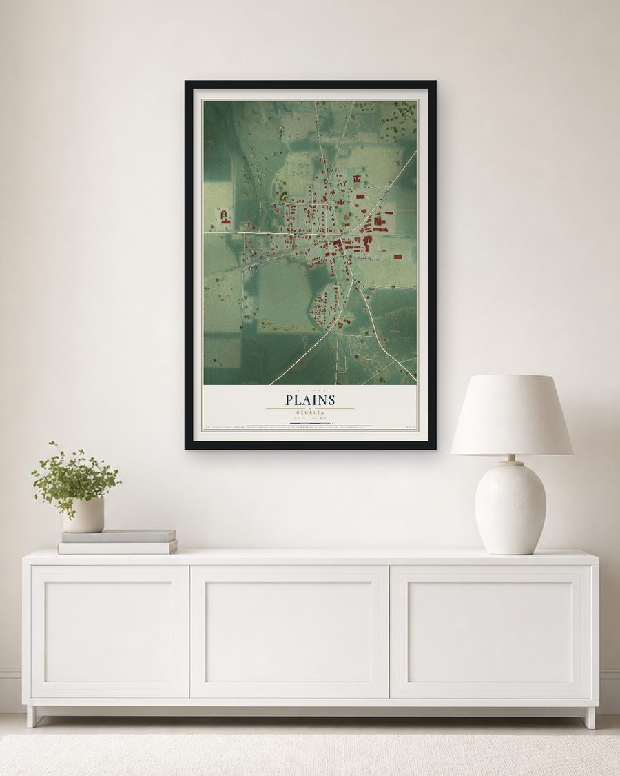 The Plains, Georgia map, 24 x 36 in, in a black wood frame on a living room wall