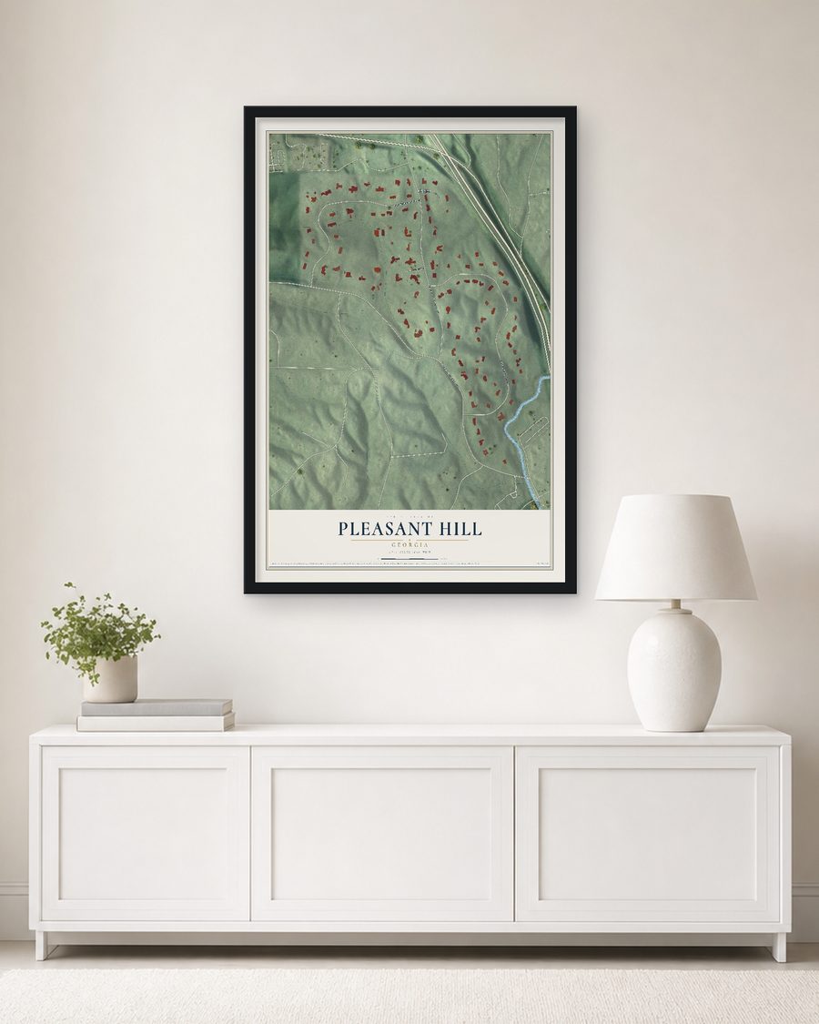 The Pleasant Hill, Georgia map, 24 x 36 in, in a black wood frame on a living room wall