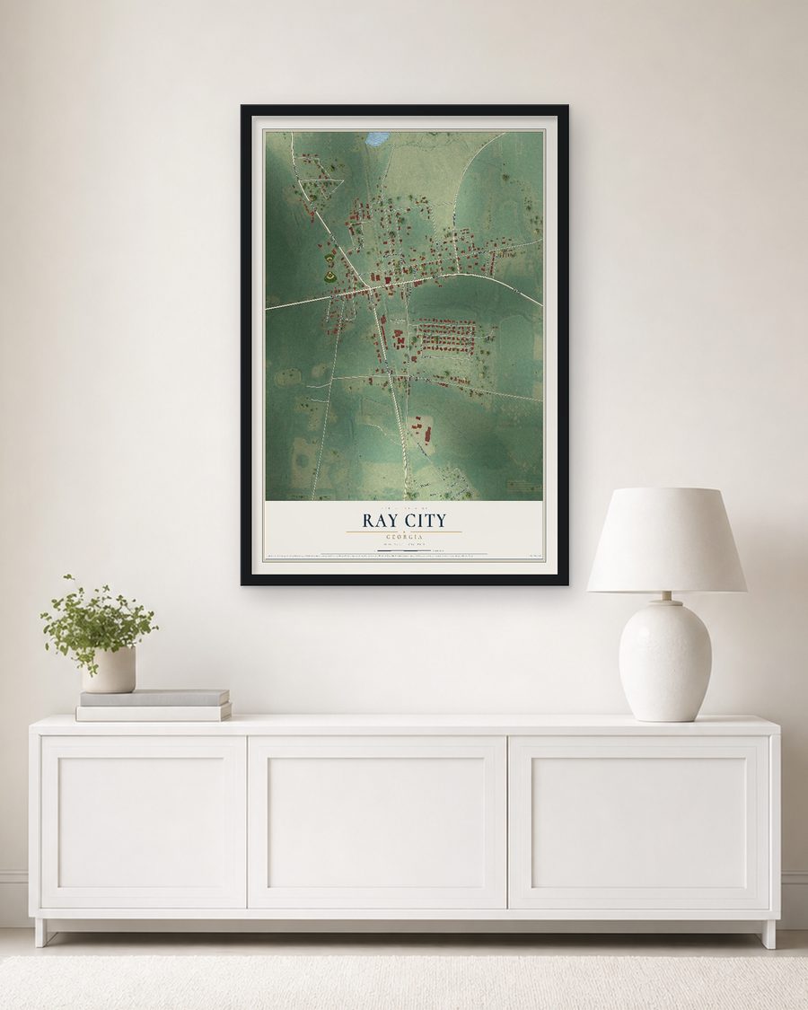 The Ray City, Georgia map, 24 x 36 in, in a black wood frame on a living room wall