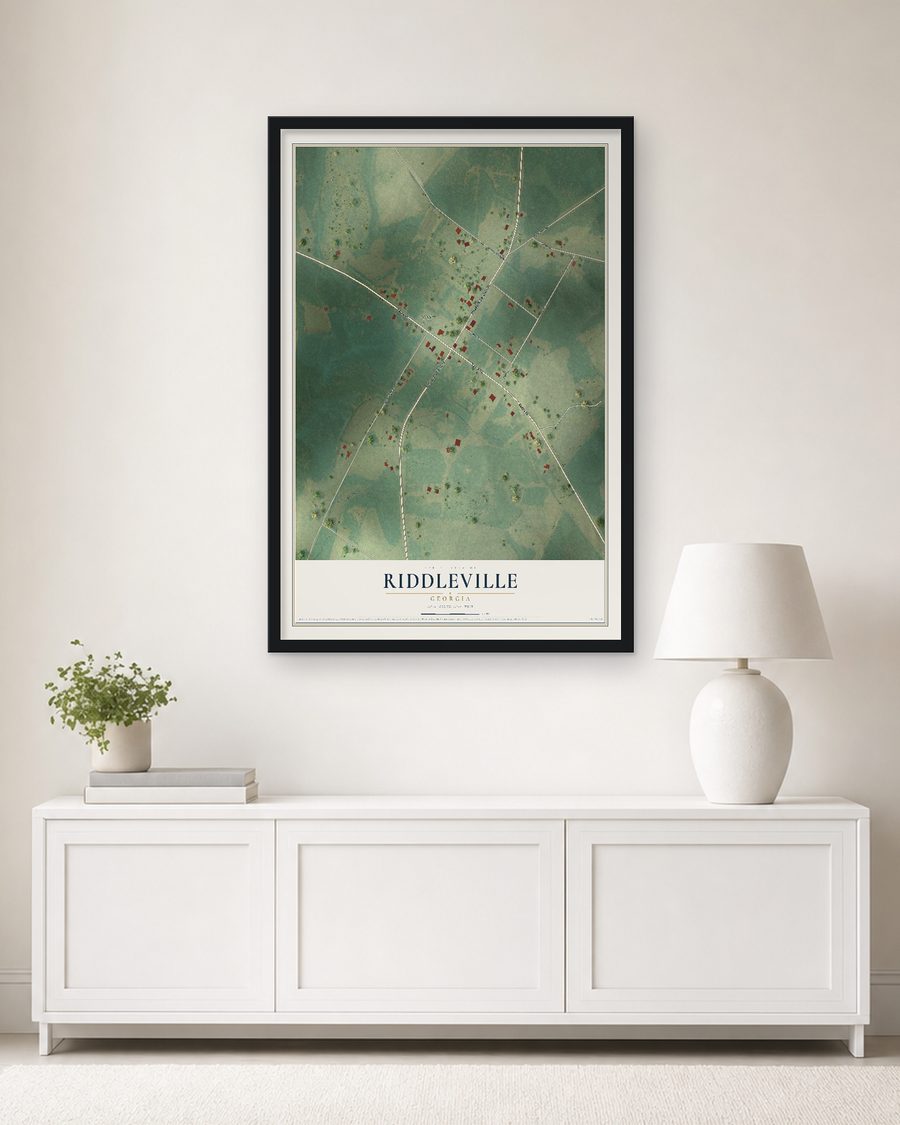 The Riddleville, Georgia map, 24 x 36 in, in a black wood frame on a living room wall