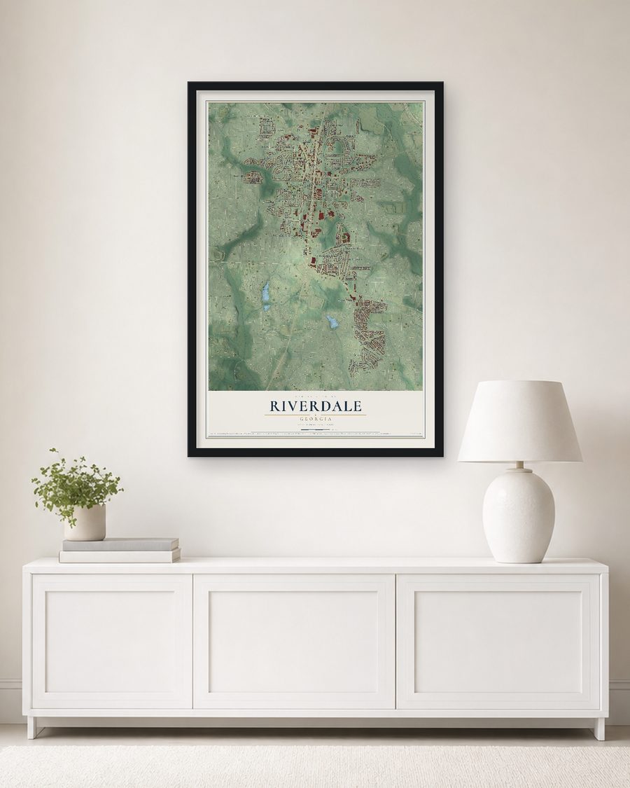 The Riverdale, Georgia map, 24 x 36 in, in a black wood frame on a living room wall