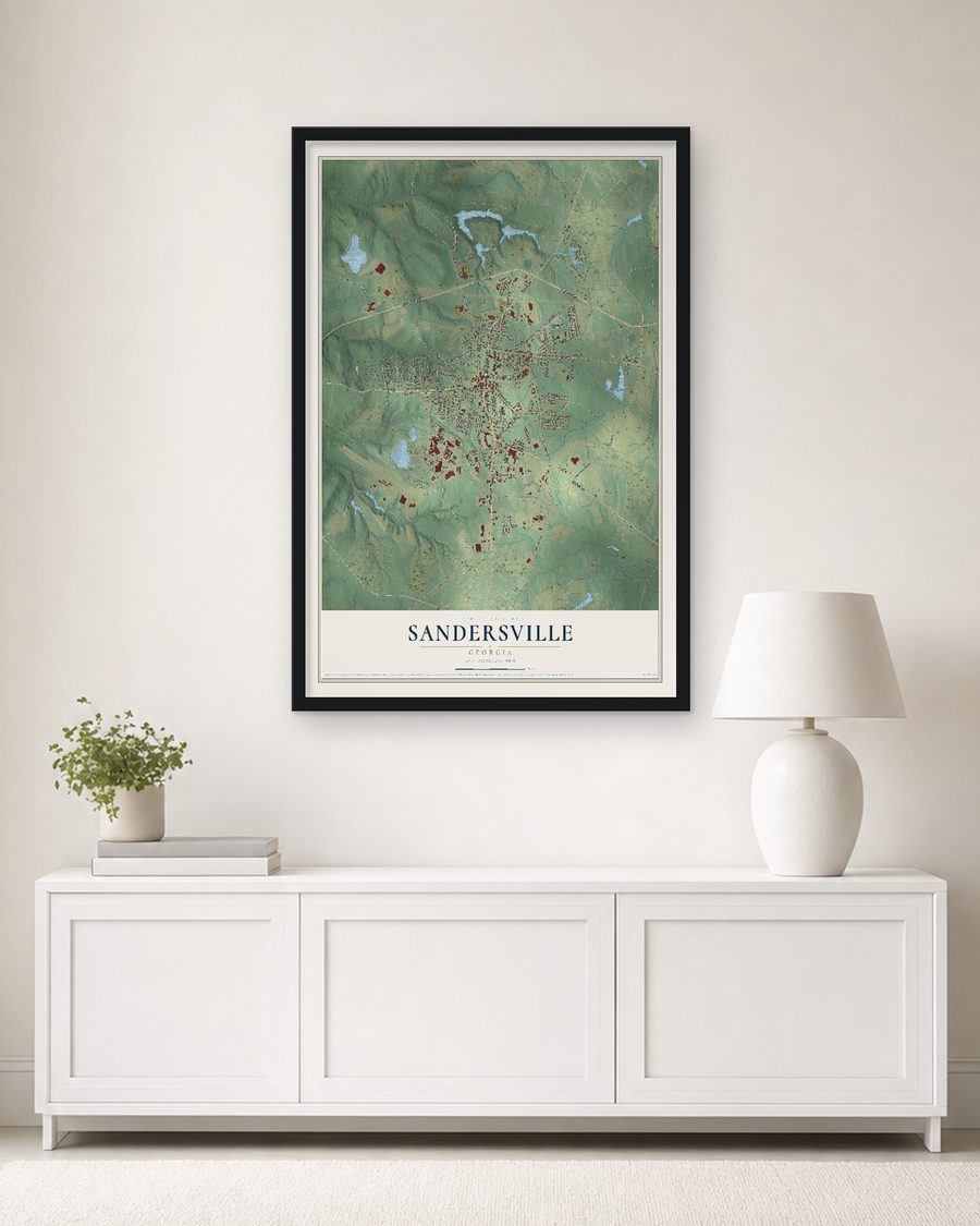 The Sandersville, Georgia map, 24 x 36 in, in a black wood frame on a living room wall