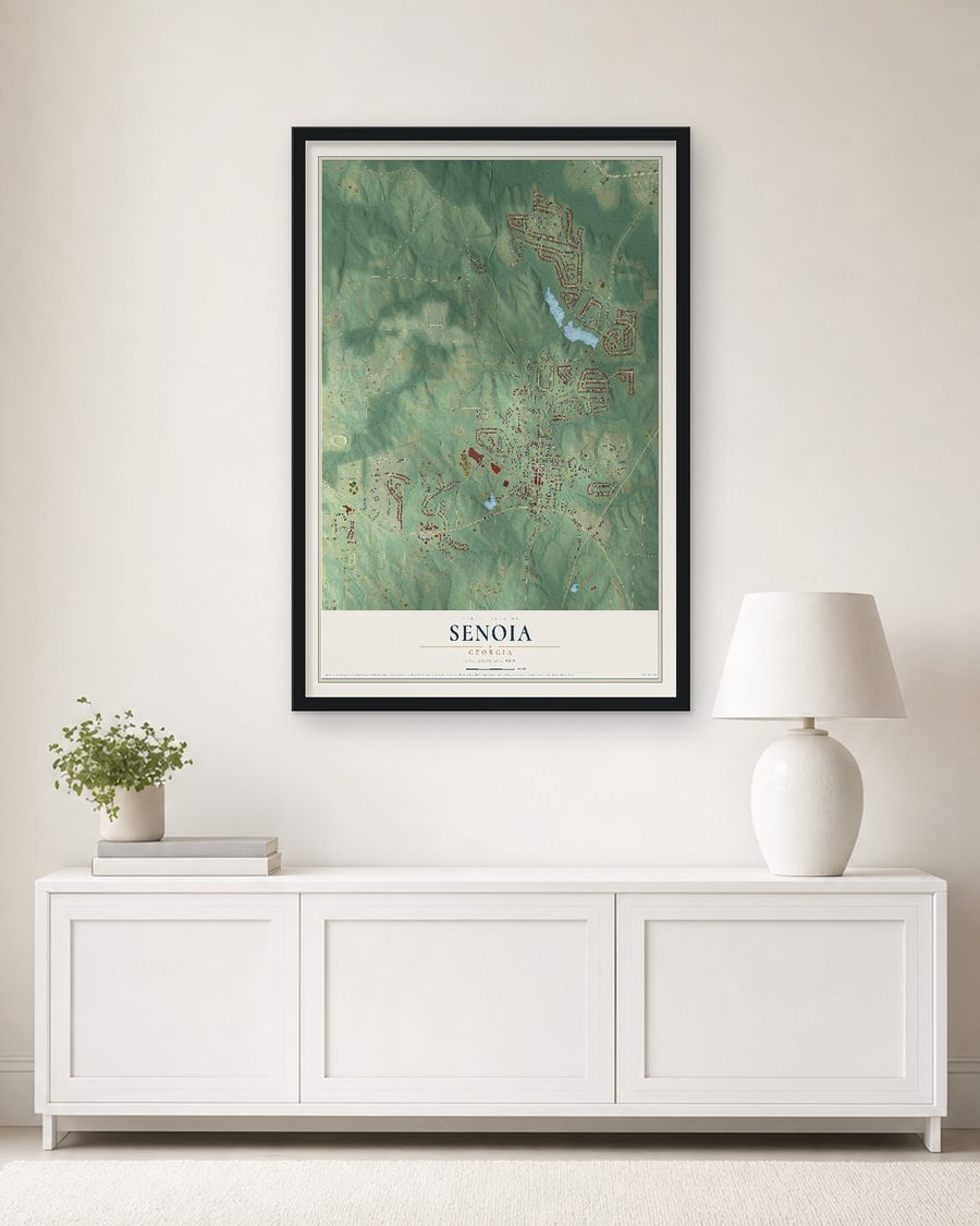 The Senoia, Georgia map, 24 x 36 in, in a black wood frame on a living room wall