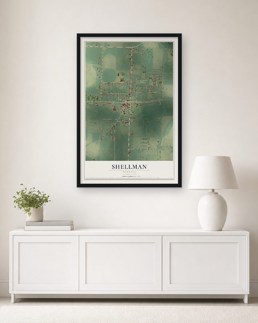 The Shellman, Georgia map, 24 x 36 in, in a black wood frame on a living room wall