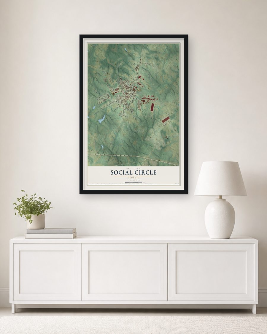 The Social Circle, Georgia map, 24 x 36 in, in a black wood frame on a living room wall
