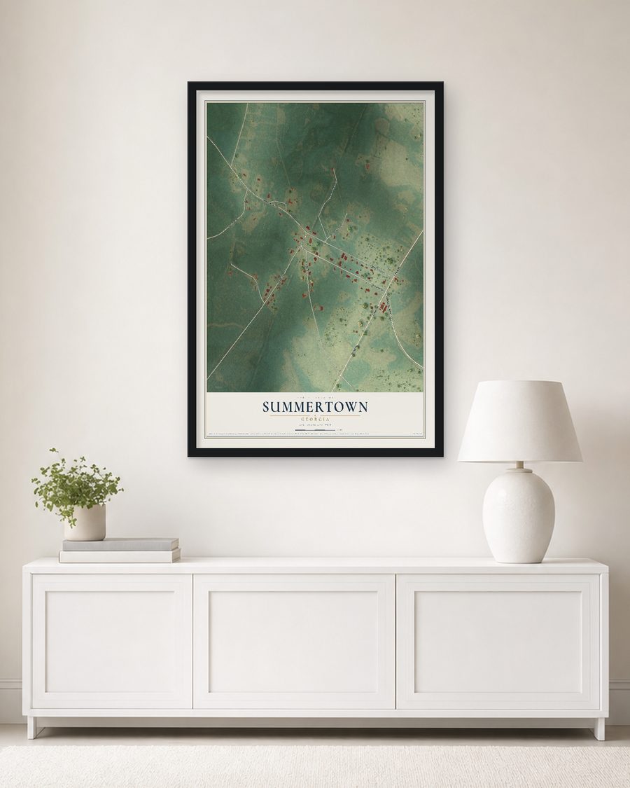 The Summertown, Georgia map, 24 x 36 in, in a black wood frame on a living room wall