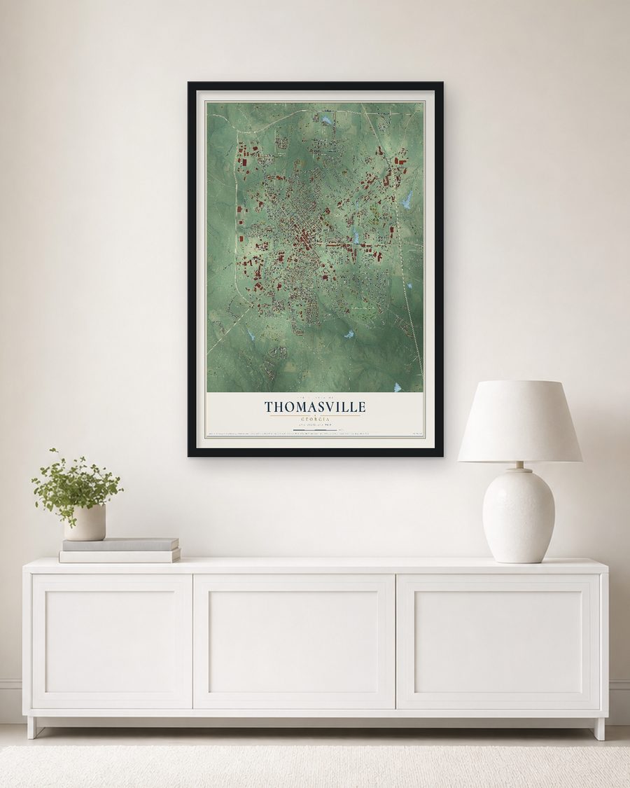 The Thomasville, Georgia map, 24 x 36 in, in a black wood frame on a living room wall