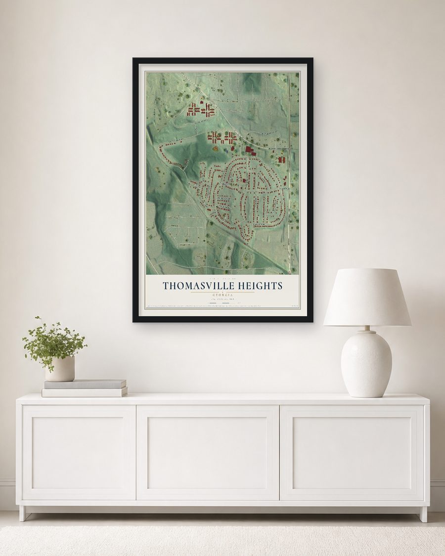 The Thomasville Heights, Georgia map, 24 x 36 in, in a black wood frame on a living room wall