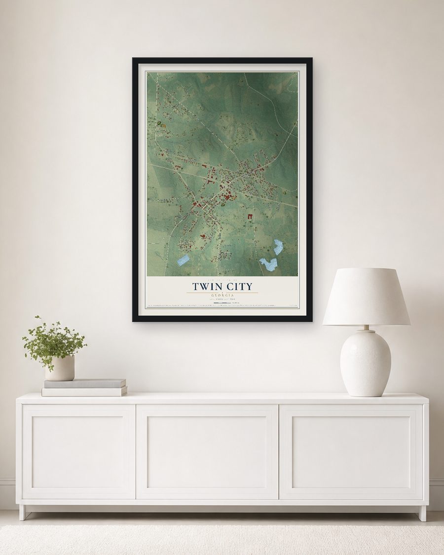 The Twin City, Georgia map, 24 x 36 in, in a black wood frame on a living room wall