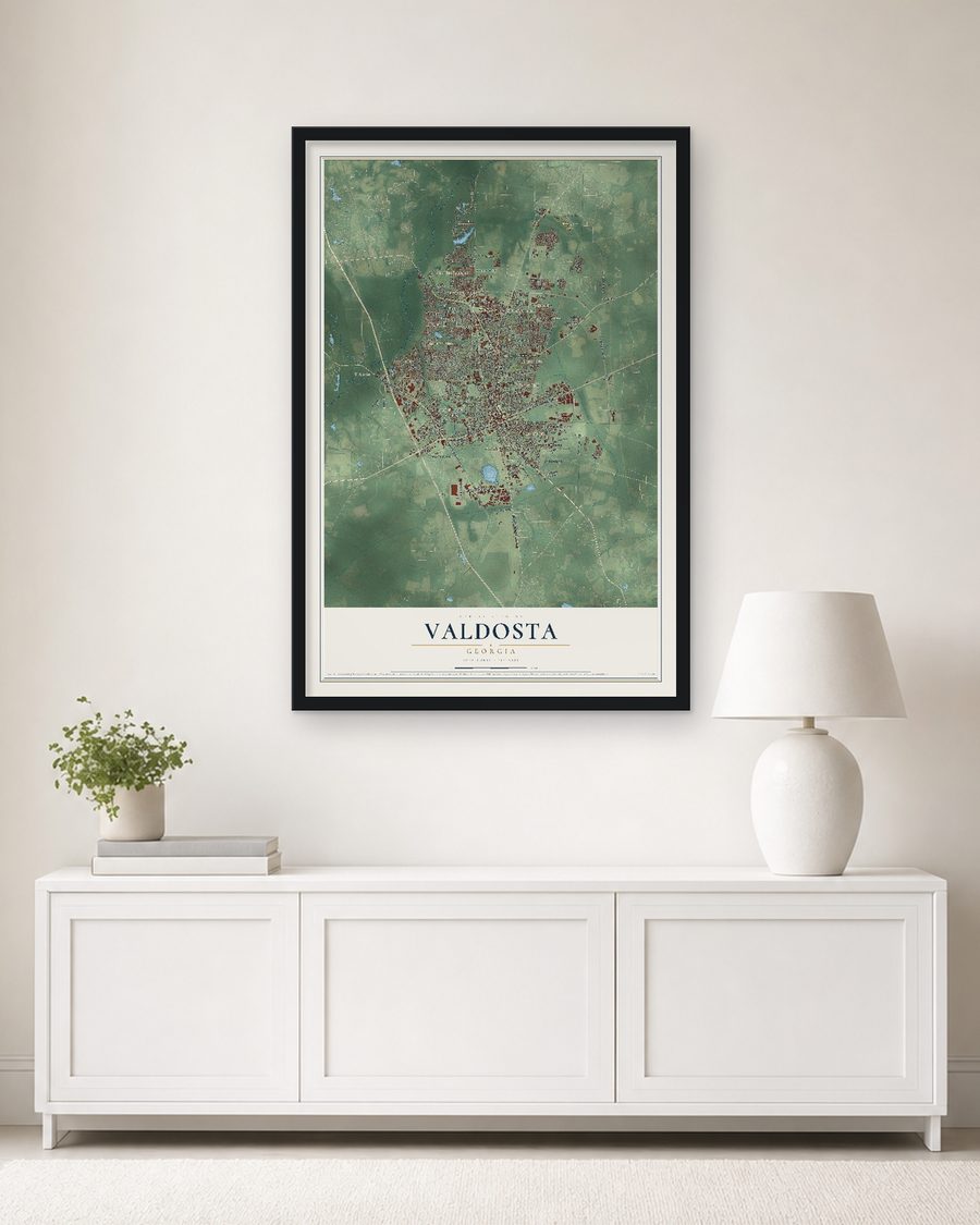 The Valdosta, Georgia map, 24 x 36 in, in a black wood frame on a living room wall