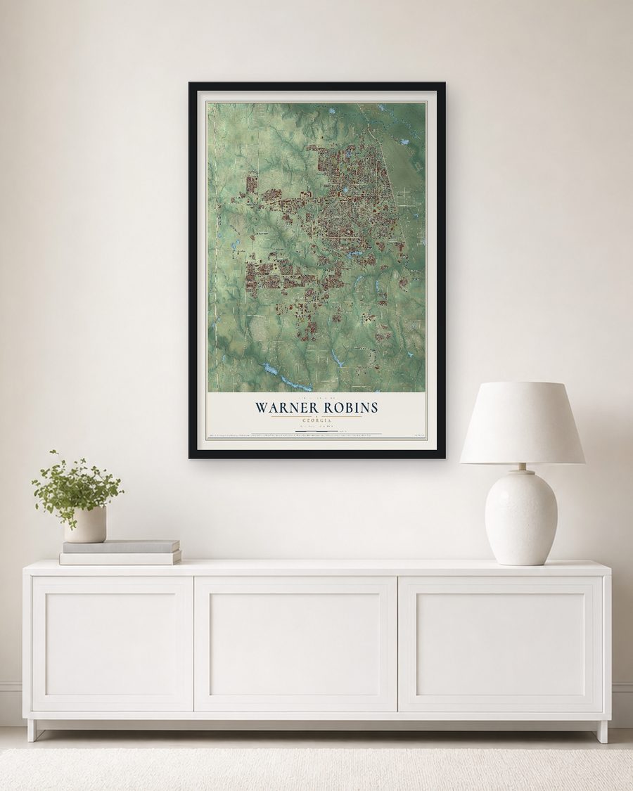 The Warner Robins, Georgia map, 24 x 36 in, in a black wood frame on a living room wall