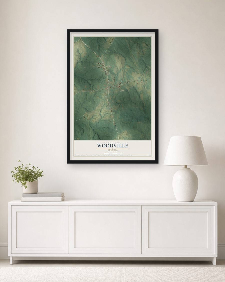 The Woodville, Georgia map, 24 x 36 in, in a black wood frame on a living room wall