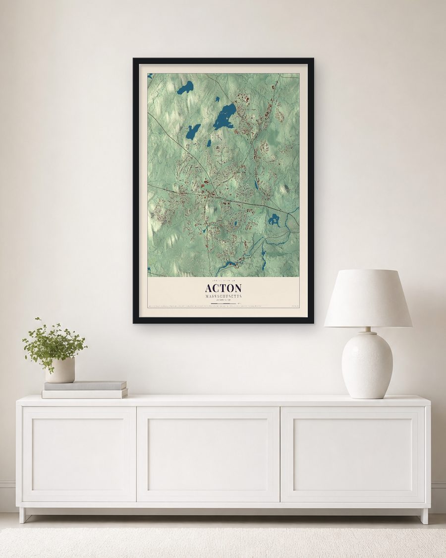 The Acton, Massachusetts map, 24 x 36 in, in a black wood frame on a living room wall