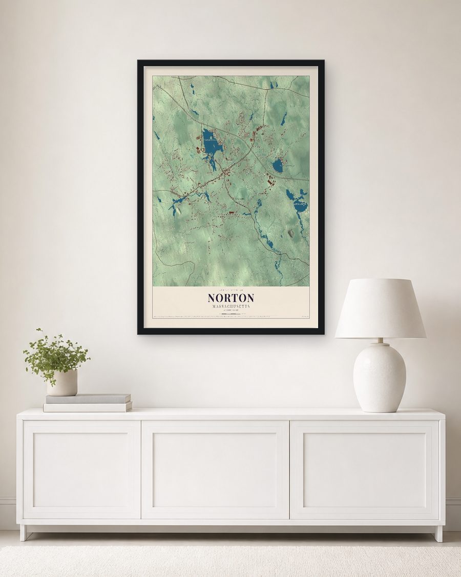 The Norton, Massachusetts map, 24 x 36 in, in a black wood frame on a living room wall