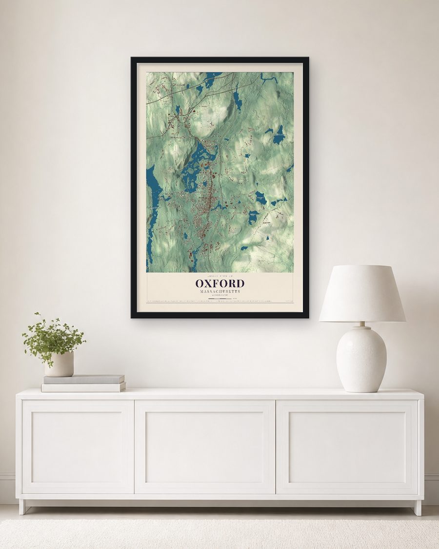 The Oxford, Massachusetts map, 24 x 36 in, in a black wood frame on a living room wall