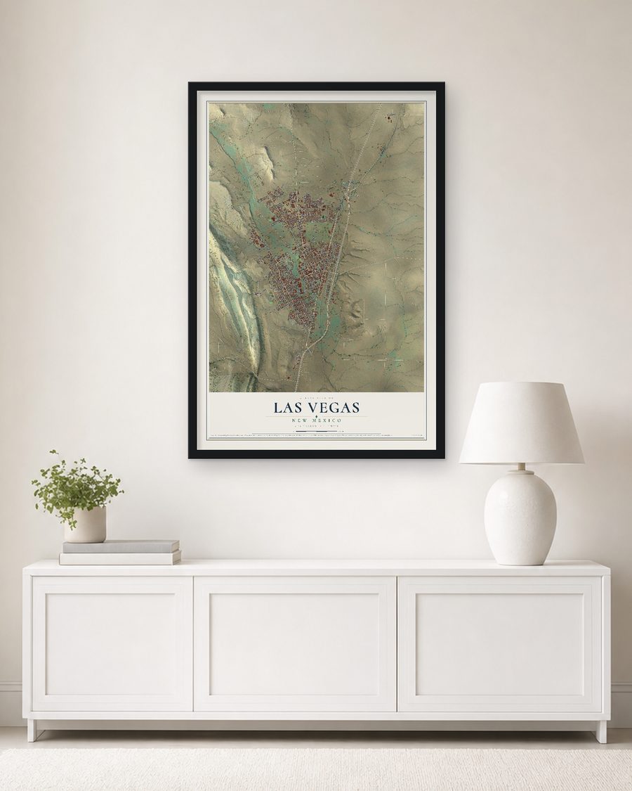 The Las Vegas, New Mexico map, 24 x 36 in, in a black wood frame on a living room wall