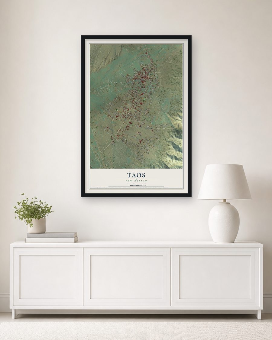 The Taos, New Mexico map, 24 x 36 in, in a black wood frame on a living room wall