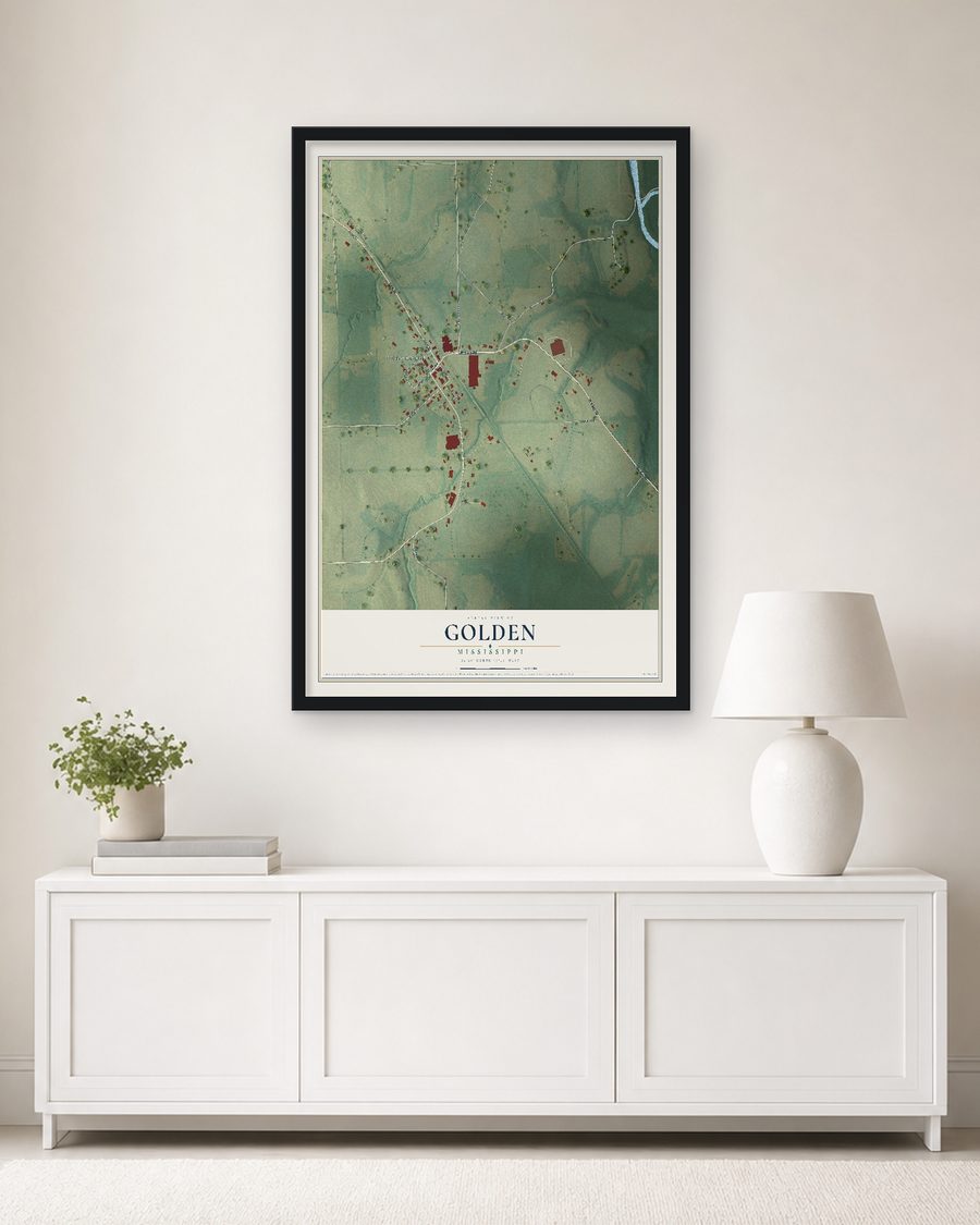 The Golden, Mississippi map, 24 x 36 in, in a black wood frame on a living room wall