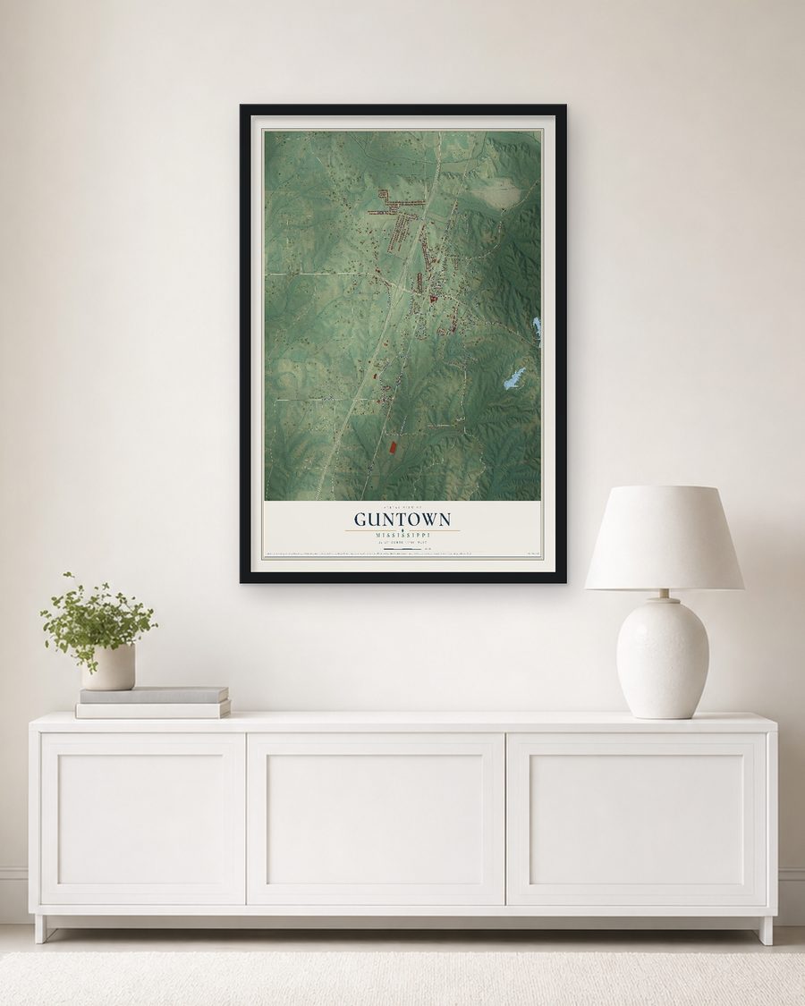 The Guntown, Mississippi map, 24 x 36 in, in a black wood frame on a living room wall