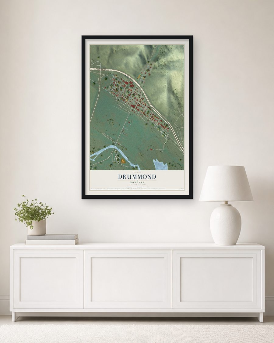 The Drummond, Montana map, 24 x 36 in, in a black wood frame on a living room wall
