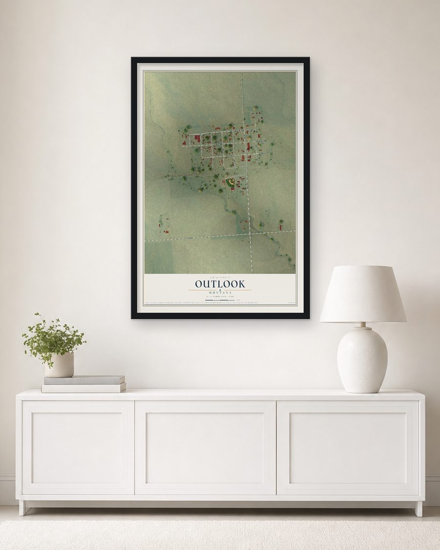 The Outlook, Montana map, 24 x 36 in, in a black wood frame on a living room wall