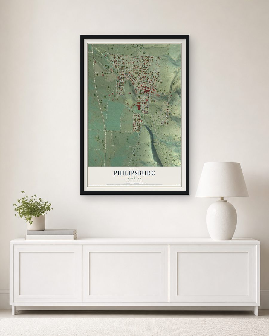 The Philipsburg, Montana map, 24 x 36 in, in a black wood frame on a living room wall