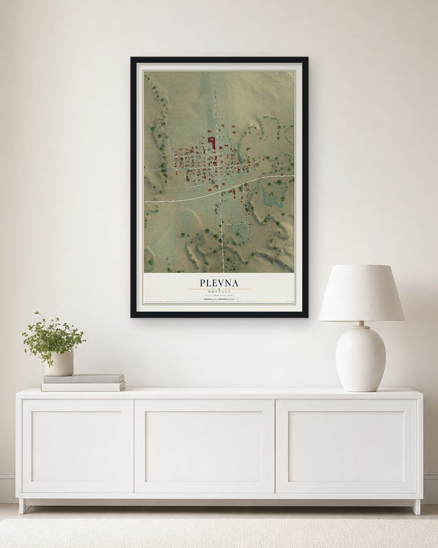 The Plevna, Montana map, 24 x 36 in, in a black wood frame on a living room wall