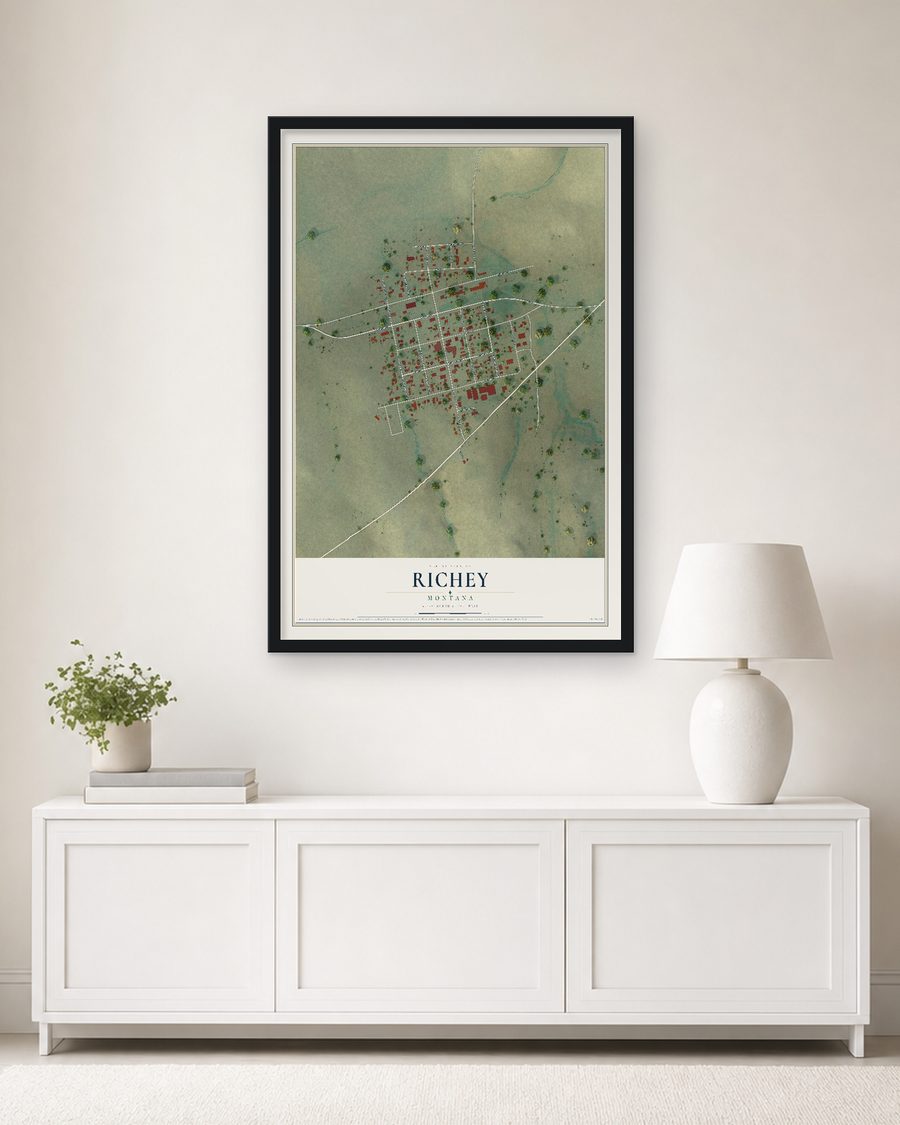 The Richey, Montana map, 24 x 36 in, in a black wood frame on a living room wall