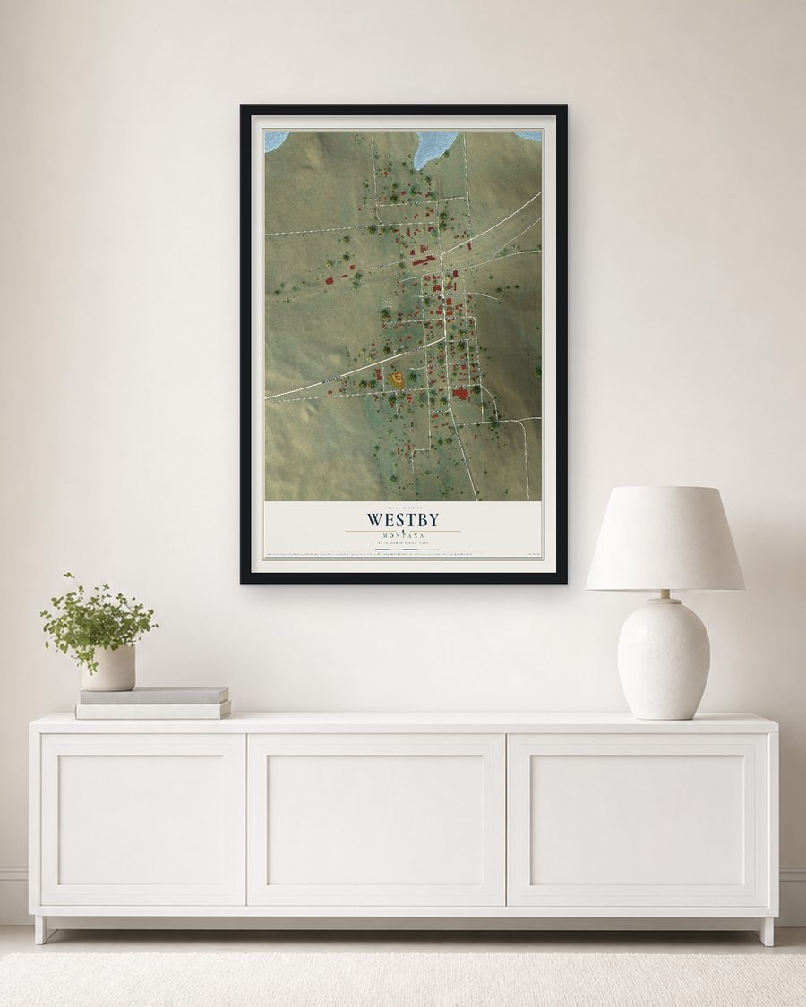 The Westby, Montana map, 24 x 36 in, in a black wood frame on a living room wall