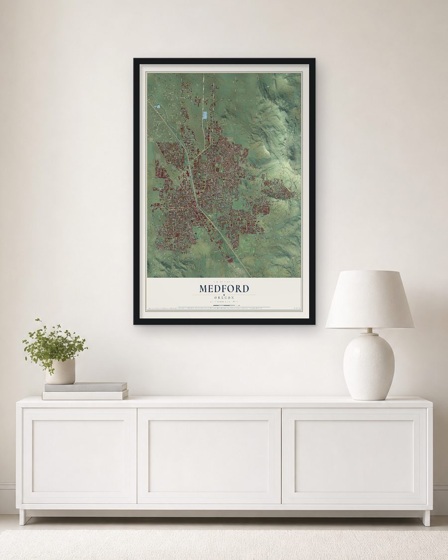 The Medford, Oregon map, 24 x 36 in, in a black wood frame on a living room wall