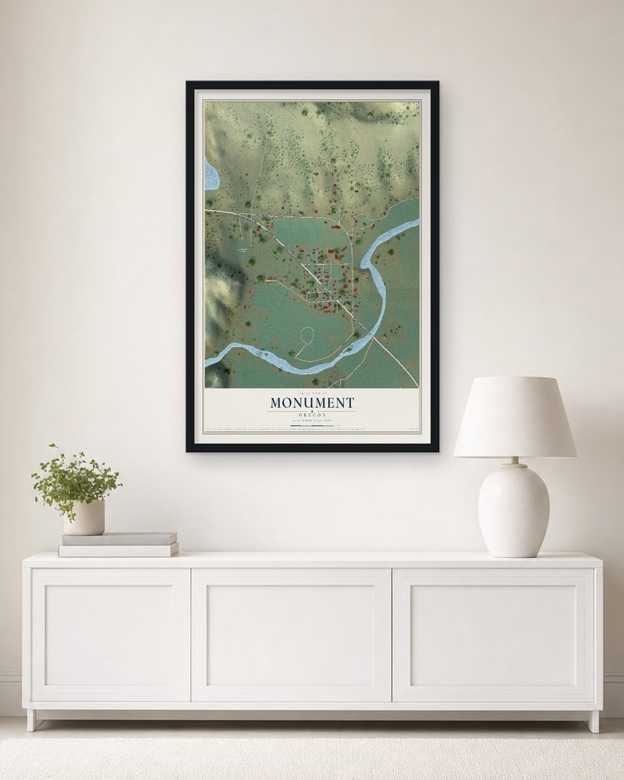 The Monument, Oregon map, 24 x 36 in, in a black wood frame on a living room wall