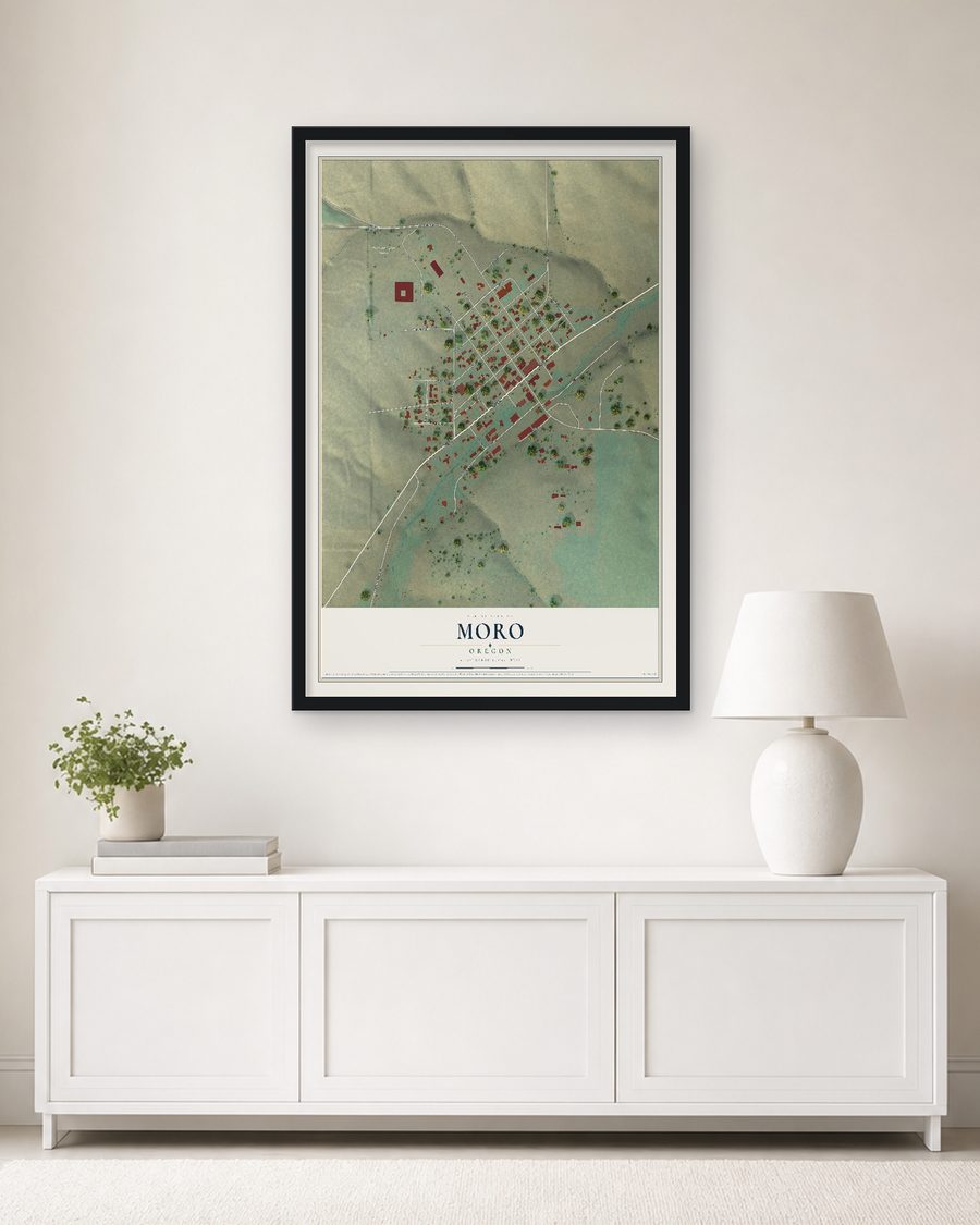The Moro, Oregon map, 24 x 36 in, in a black wood frame on a living room wall