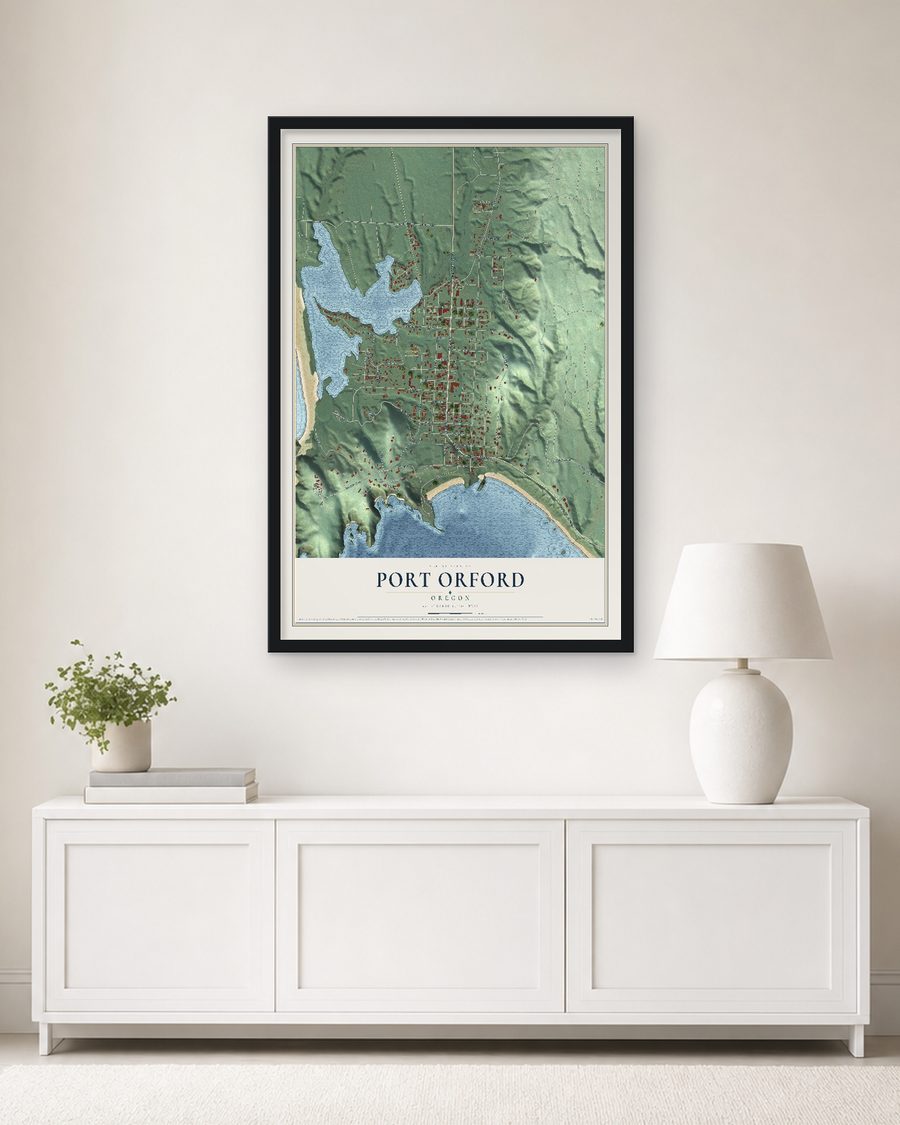 The Port Orford, Oregon map, 24 x 36 in, in a black wood frame on a living room wall