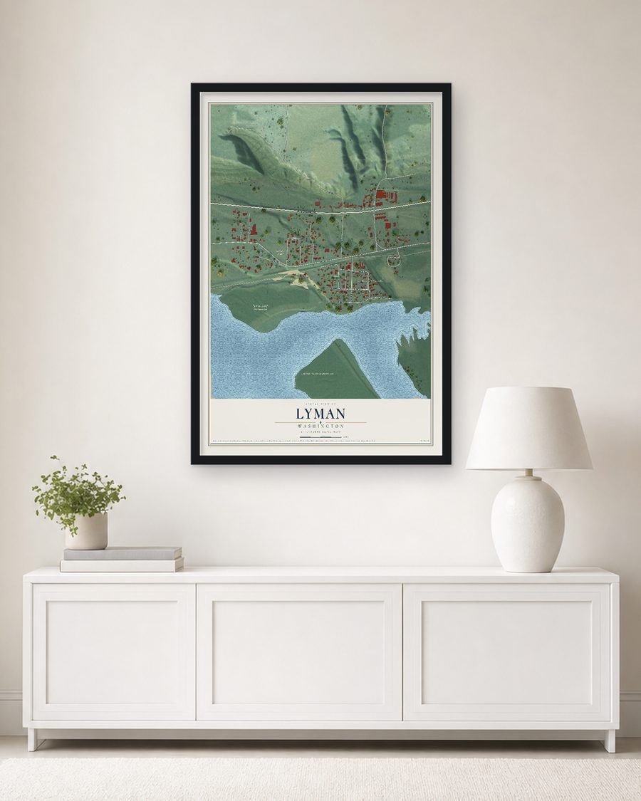 The Lyman, Washington map, 24 x 36 in, in a black wood frame on a living room wall