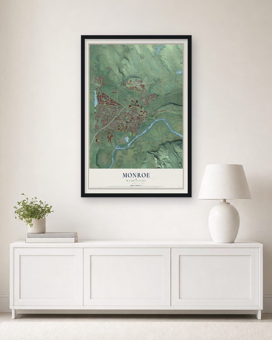 The Monroe, Washington map, 24 x 36 in, in a black wood frame on a living room wall