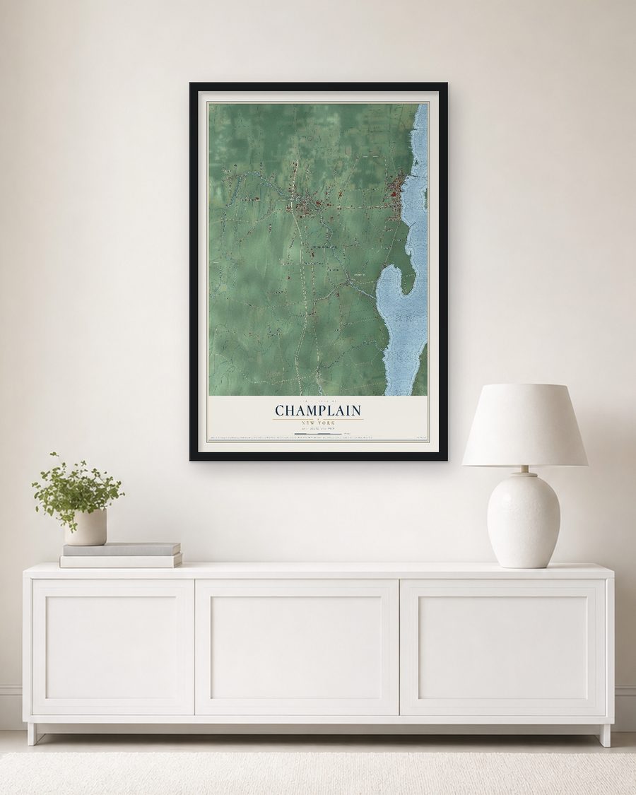 The Champlain, New York map, 24 x 36 in, in a black wood frame on a living room wall