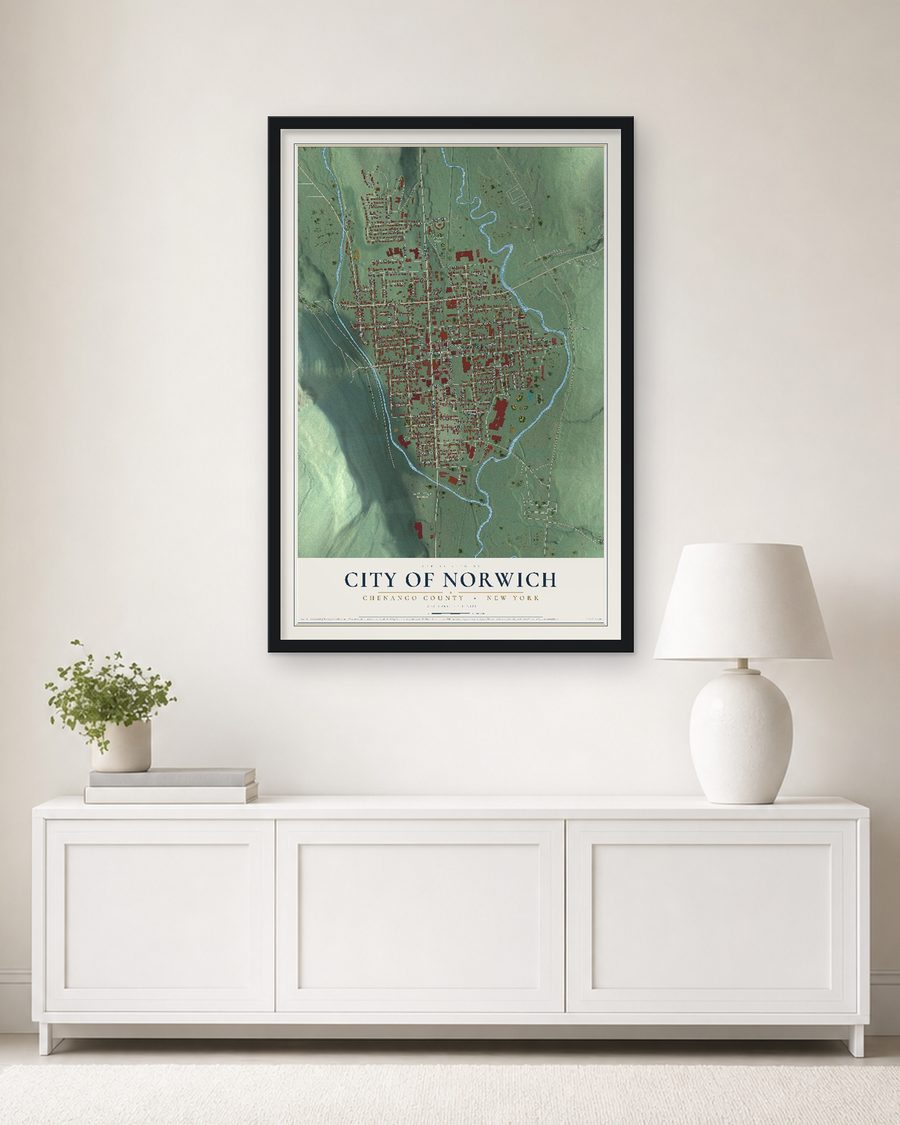 The City of Norwich, Chenango County, New York map, 24 x 36 in, in a black wood frame on a living room wall