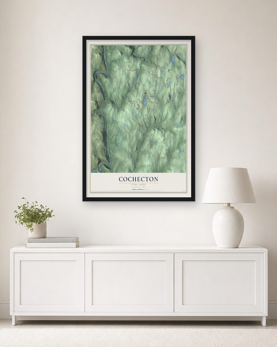 The Cochecton, New York map, 24 x 36 in, in a black wood frame on a living room wall