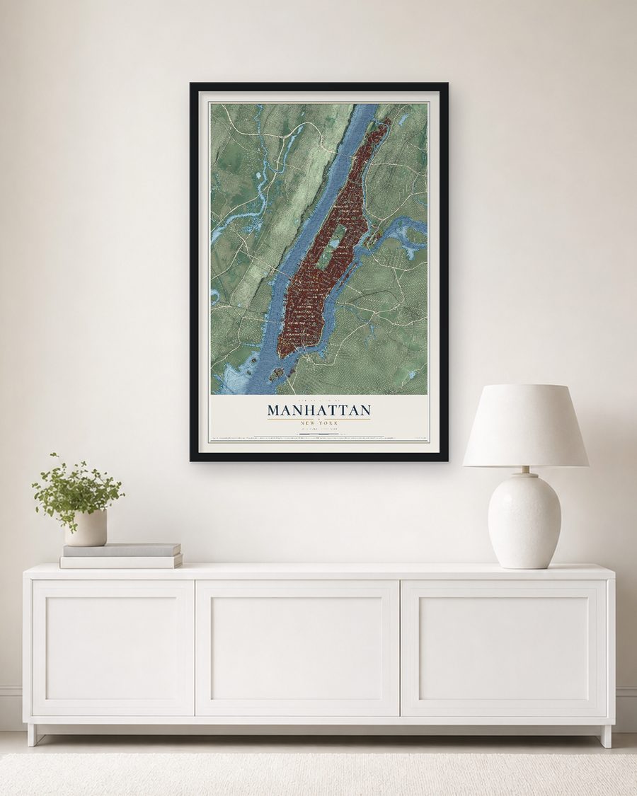 The Manhattan, New York map, 24 x 36 in, in a black wood frame on a living room wall