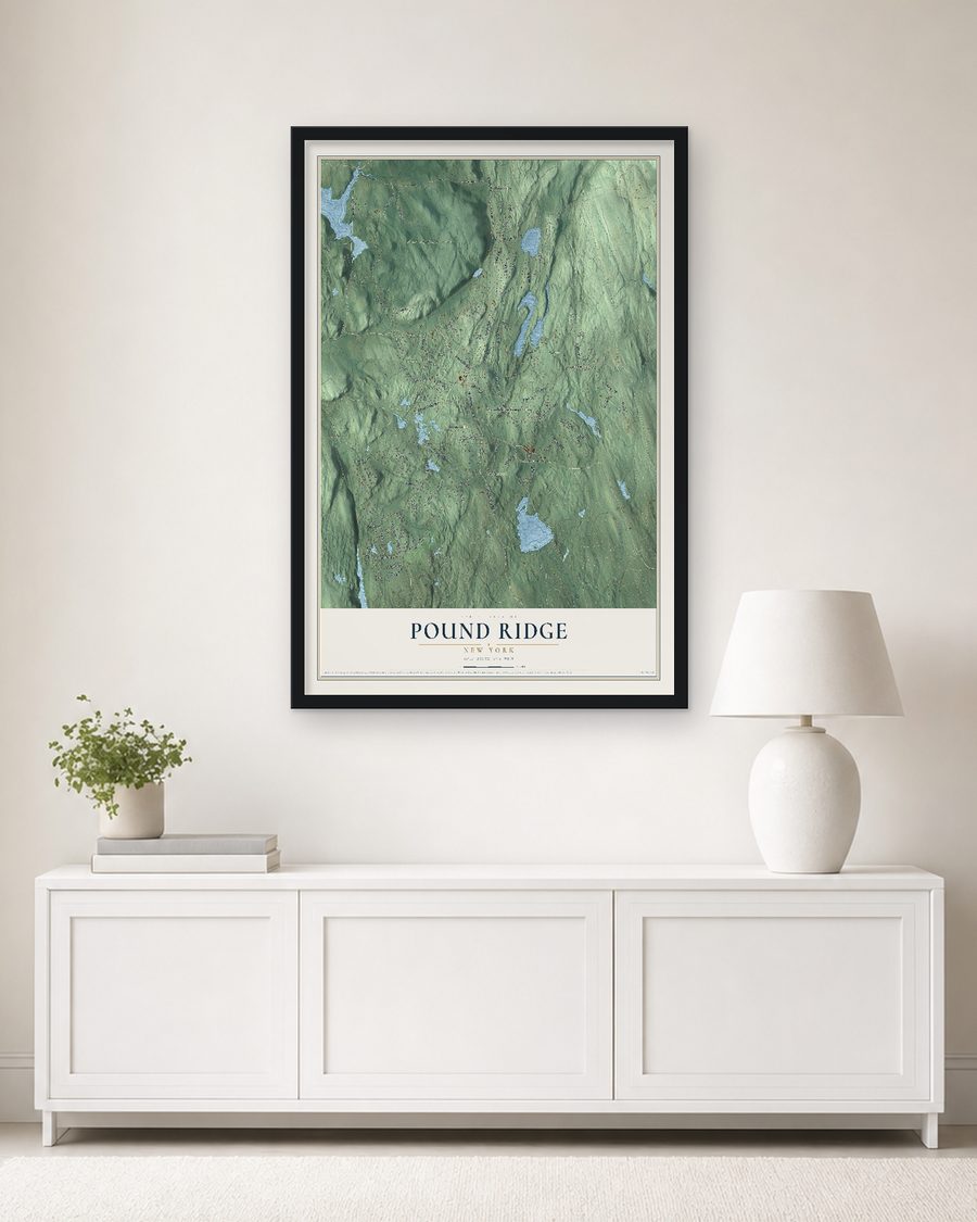 The Pound Ridge, New York map, 24 x 36 in, in a black wood frame on a living room wall