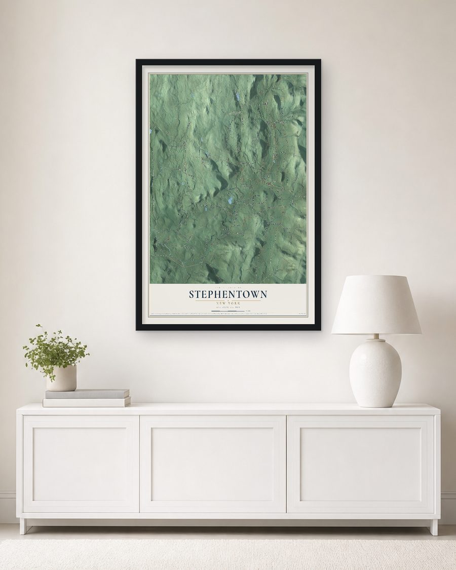 The Stephentown, New York map, 24 x 36 in, in a black wood frame on a living room wall