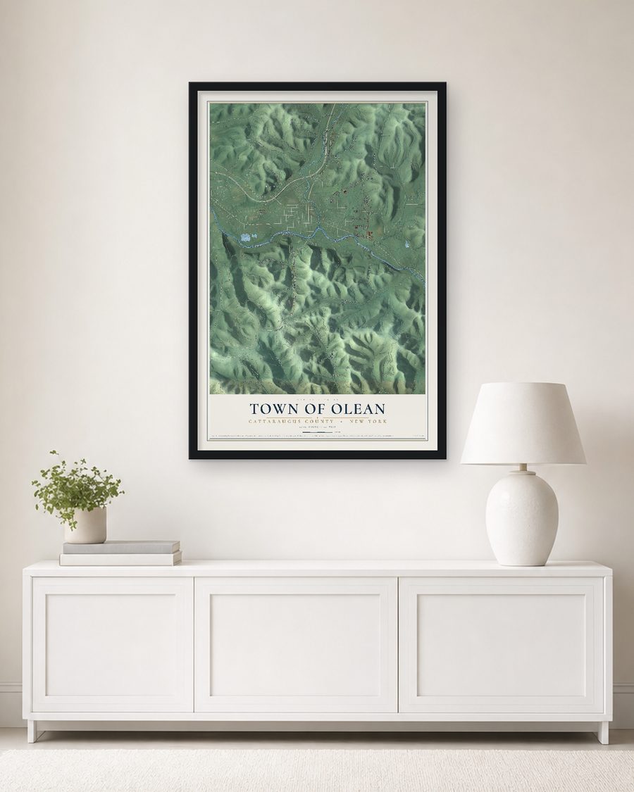 The Town of Olean, Cattaraugus County, New York map, 24 x 36 in, in a black wood frame on a living room wall