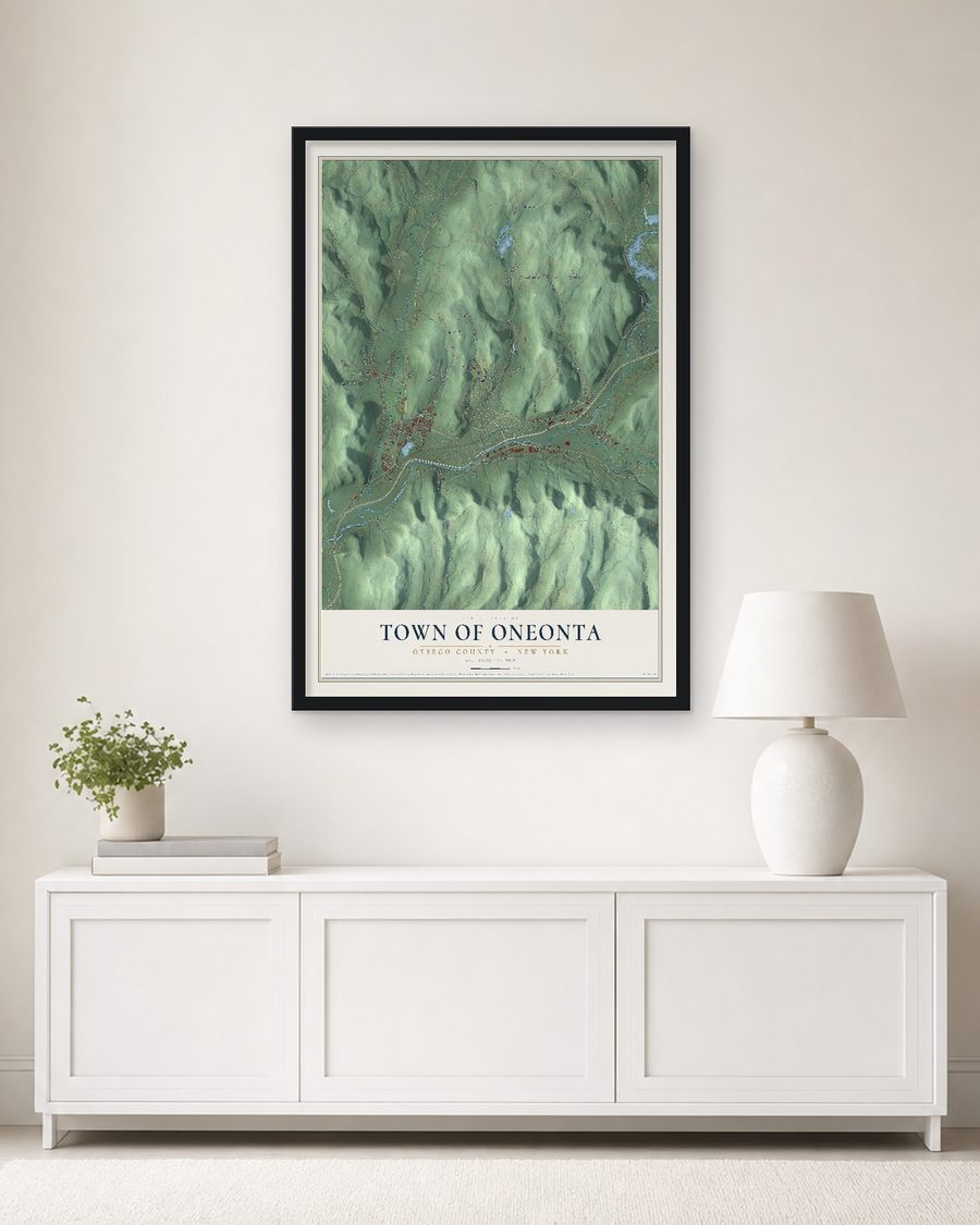 The Town of Oneonta, Otsego County, New York map, 24 x 36 in, in a black wood frame on a living room wall