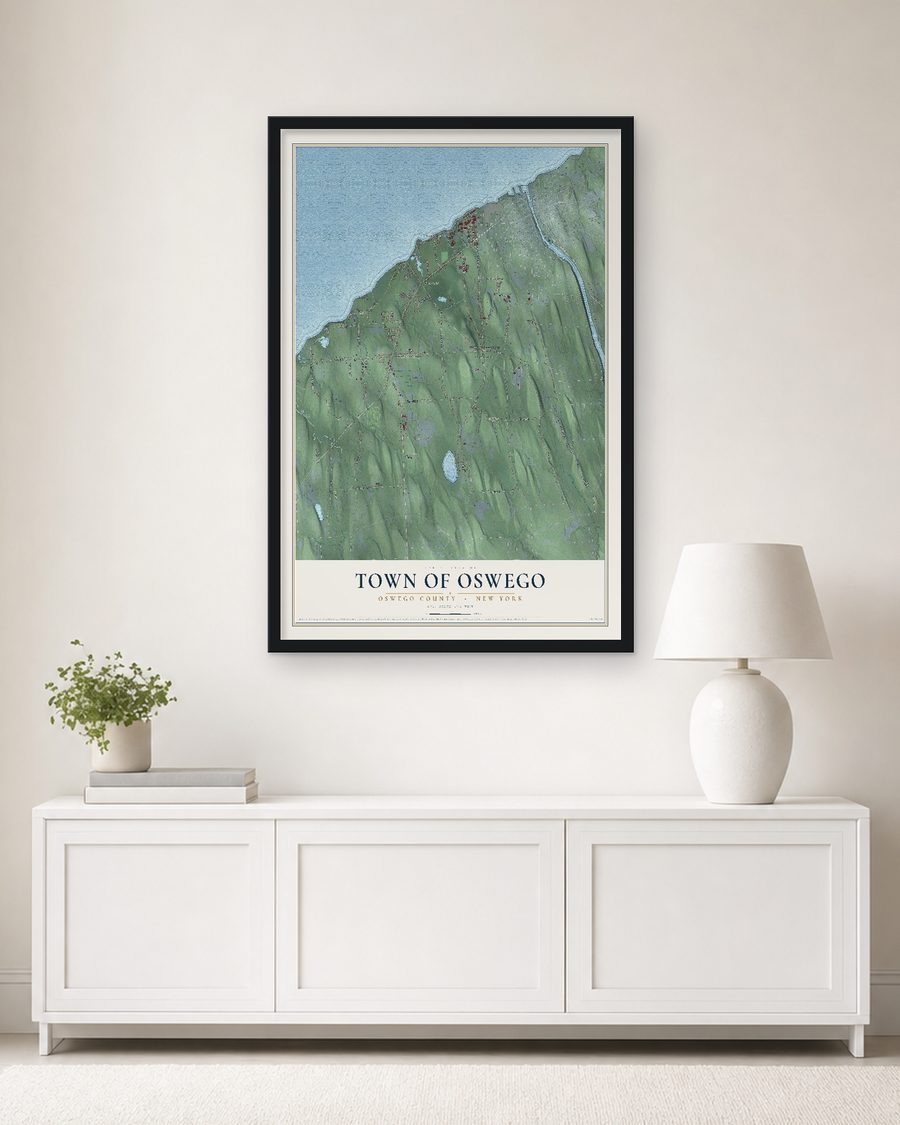 The Town of Oswego, Oswego County, New York map, 24 x 36 in, in a black wood frame on a living room wall