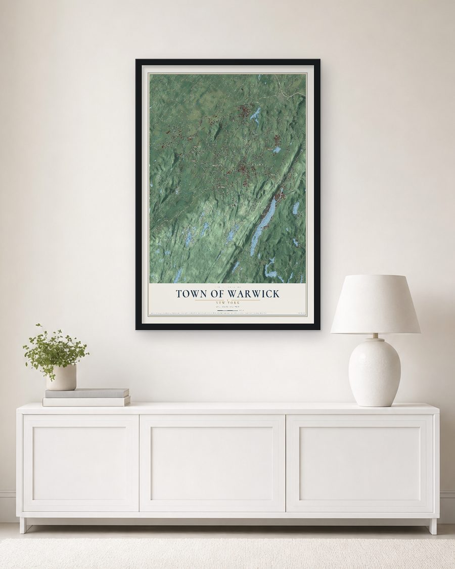 The Town of Warwick, New York map, 24 x 36 in, in a black wood frame on a living room wall