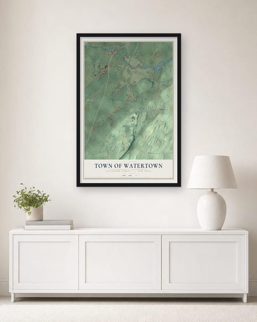 The Town of Watertown, Jefferson County, New York map, 24 x 36 in, in a black wood frame on a living room wall